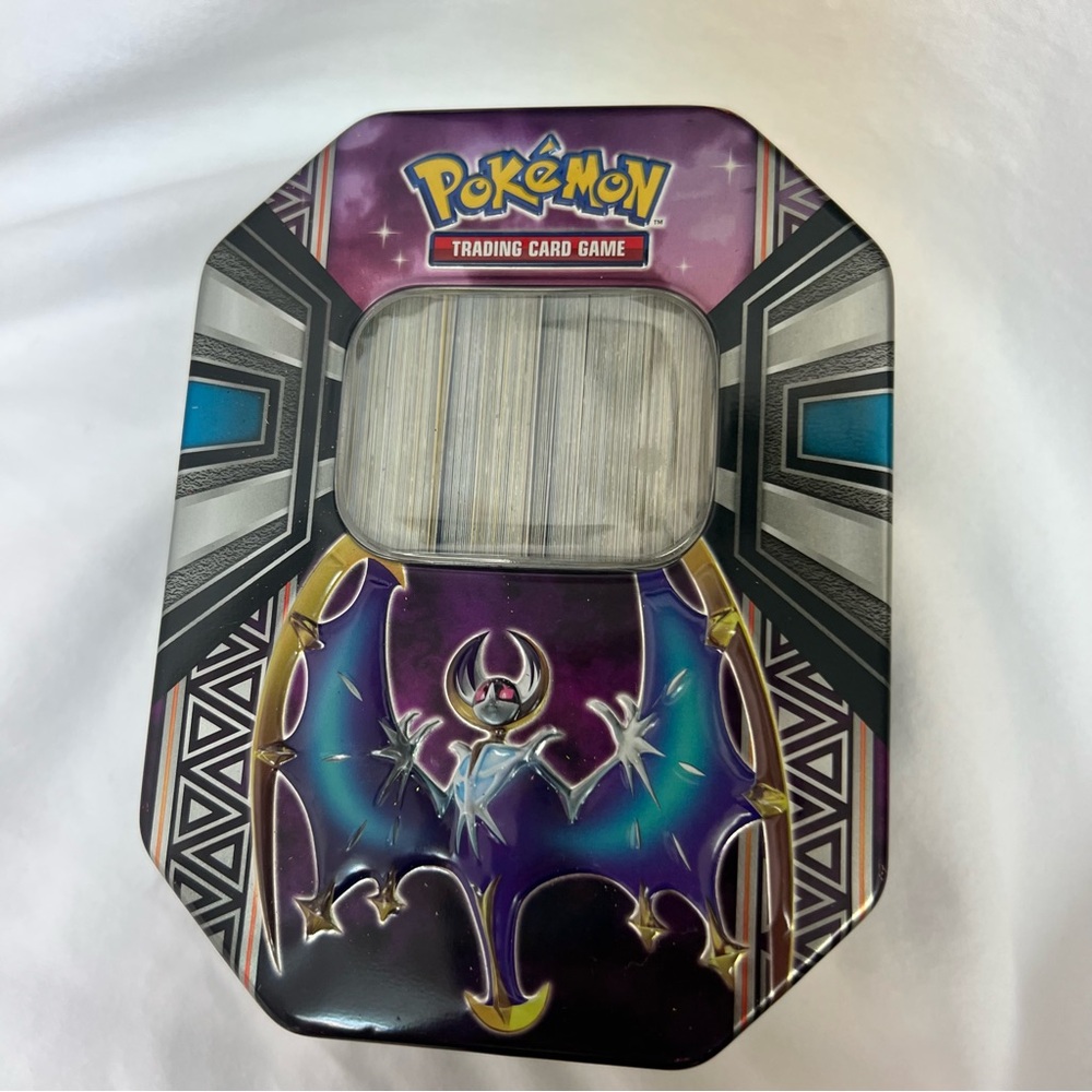 Pokémon card collection in Pokémon collectable tin.